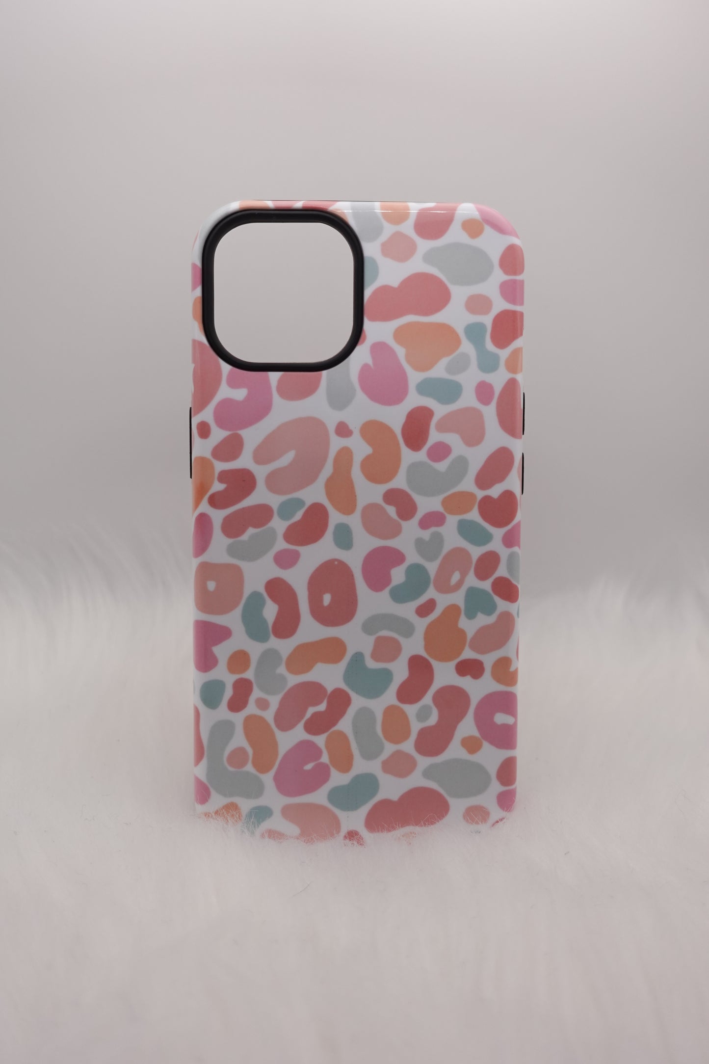 Phone case with colorful abstract pattern on a light gray background